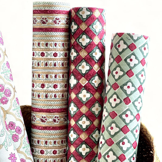 Rolls of patterned paper in a wicker basket