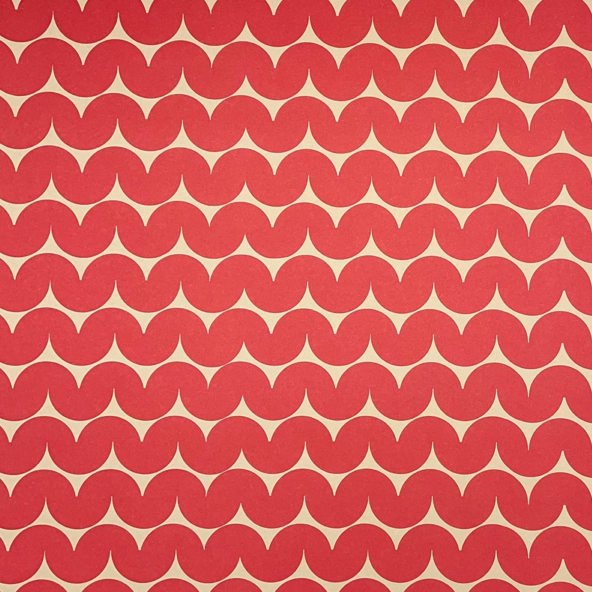 wrapping paper by Anne Davison Studio.  Bold red wiggle lines with a retro vibe on beige backdrop.