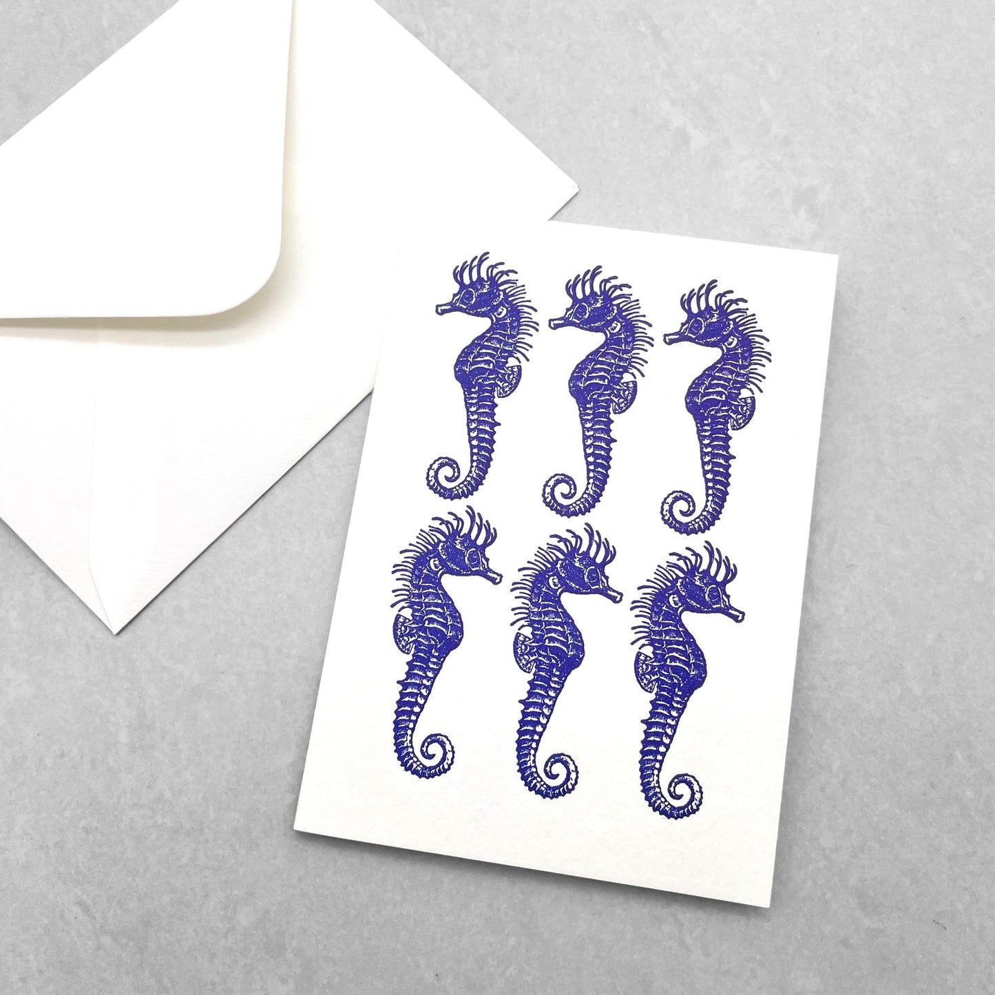 small greetings card of six blue seahorses, by Archivist Gallery