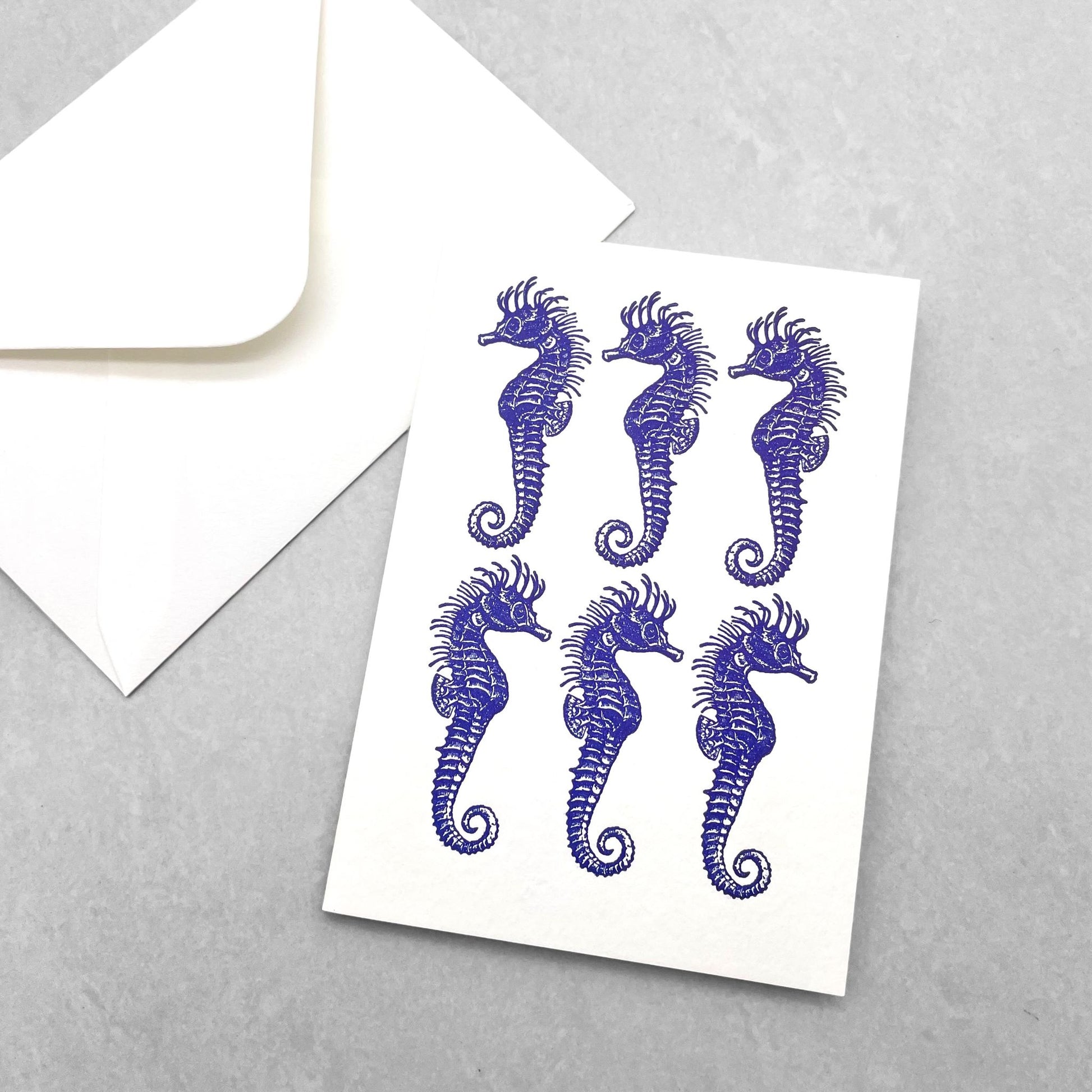 small greetings card of six blue seahorses, by Archivist Gallery