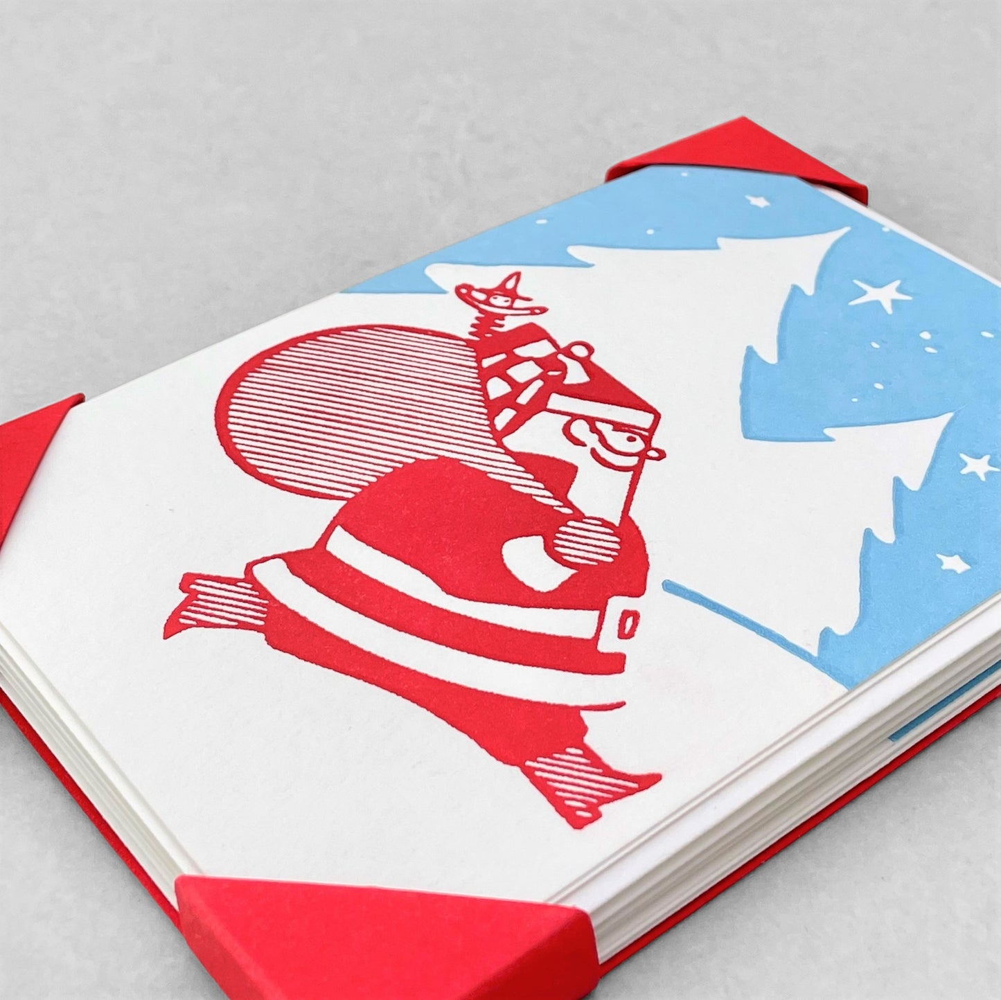 small greetings card with father christmas carrying a bag of presents , by Archivist Gallery