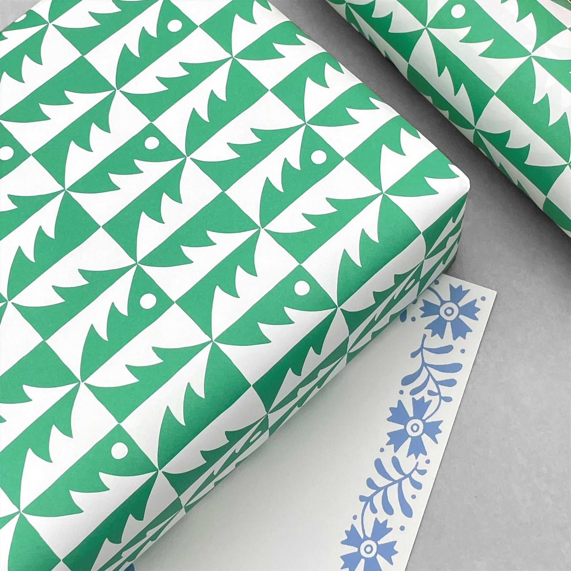 patterned paper, gift wrap, with all over pattern of green and white trees, by Ariana Martin