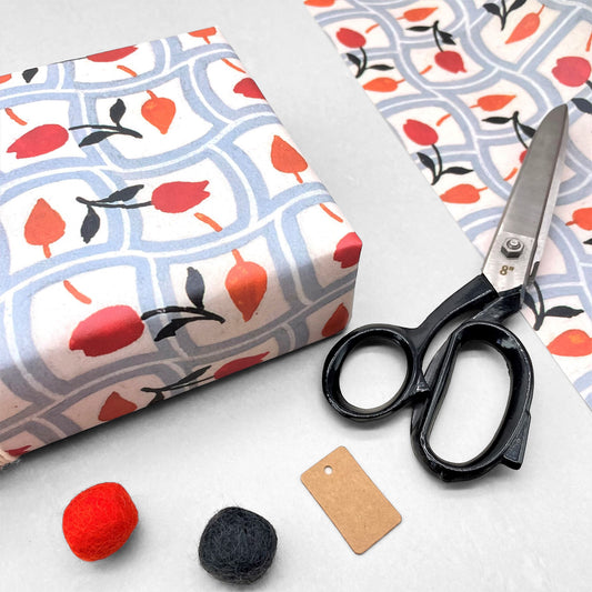 wrapping paper with repeat pattern on red tulips on a duck egg wavy grid backdrop by Artisan Deesign. Design Silver Studio