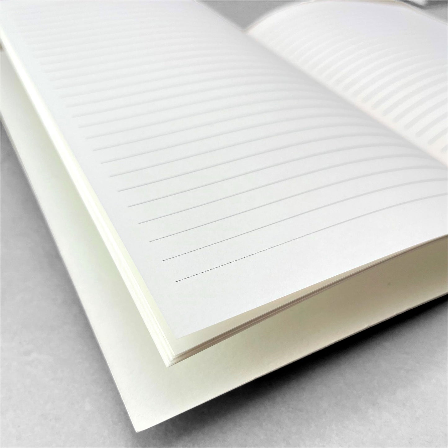 A5 slimline notebook with a delicate illustration of butterflies in burgundy on a ivory backdrop by Parisian brand Atelier Mouti