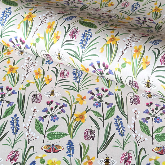 Patterned paper with colourful spring flowers and bees on a ivory background