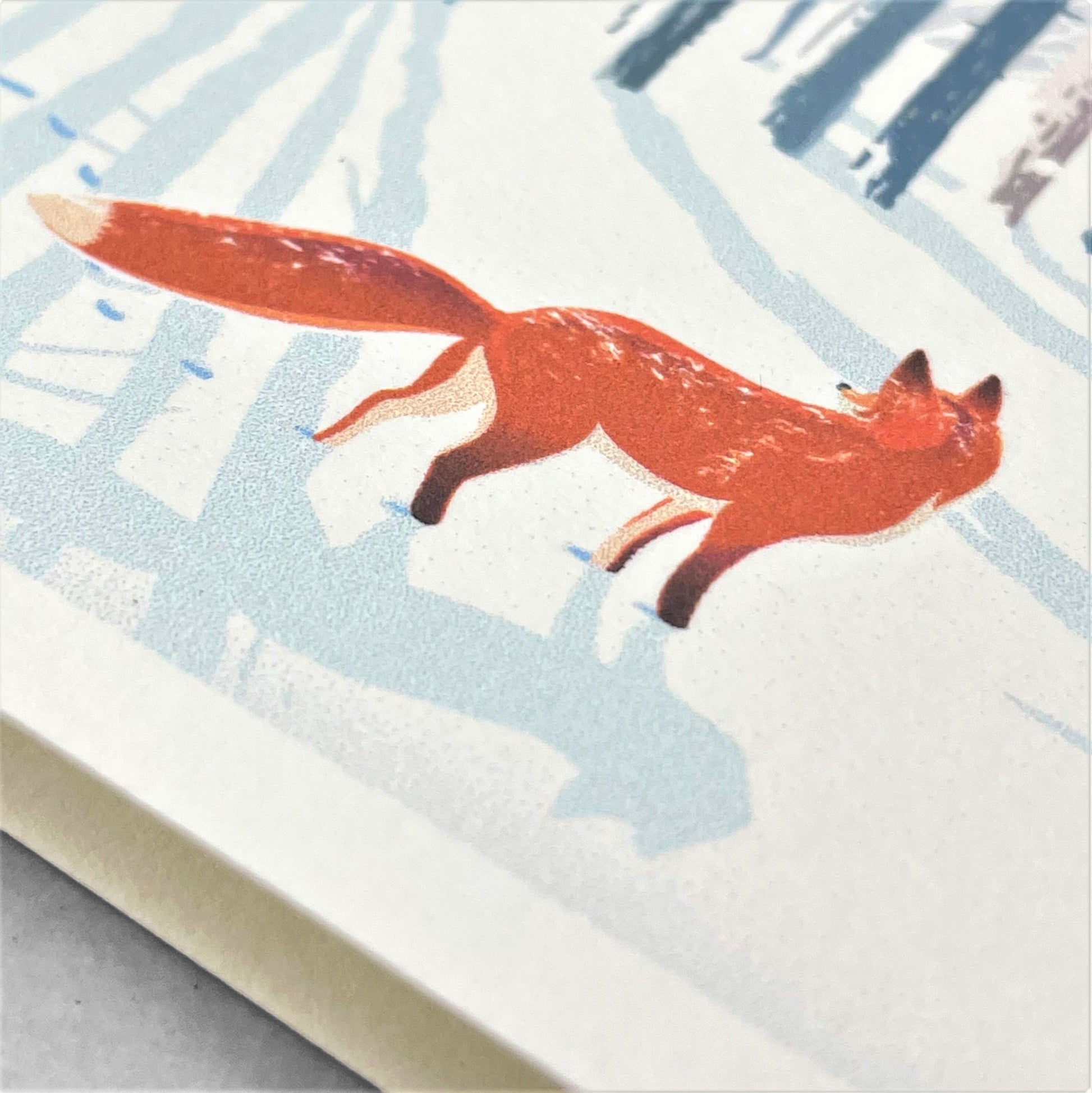 greetings card of a fox in a winter forest by Com Bossa Studio