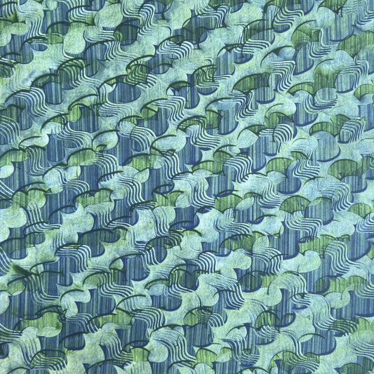 a sheet of wrapping paper with an abstract paste paper design in blue and green