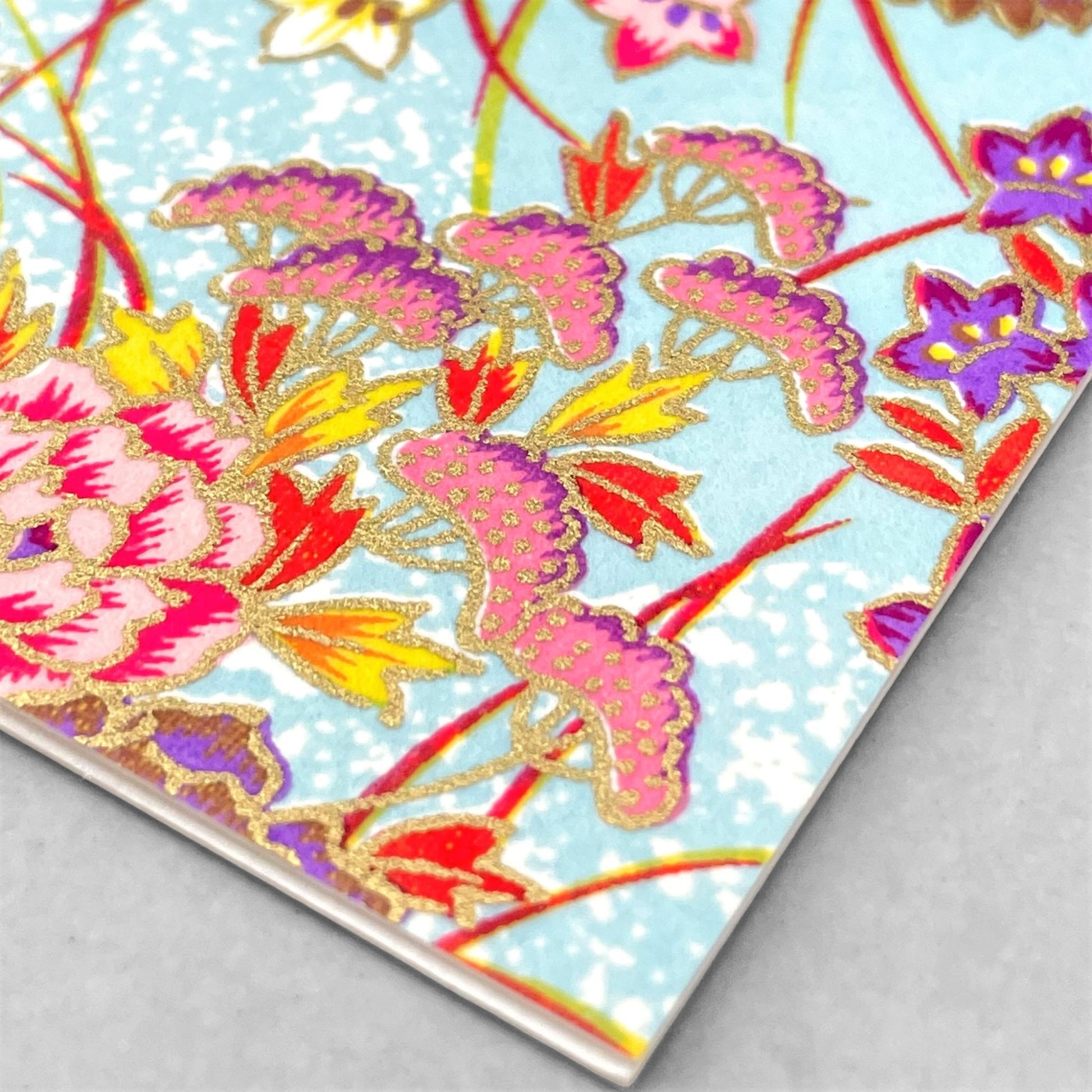 japanese silk-screen printed greetings card with bright floral pattern on a pale blue backdrop by Esmie