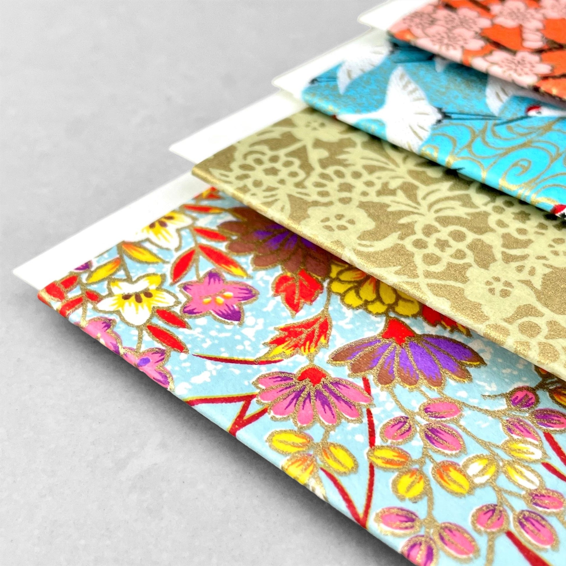 japanese silk-screen printed greetings card with bright floral pattern on a pale blue backdrop by Esmie