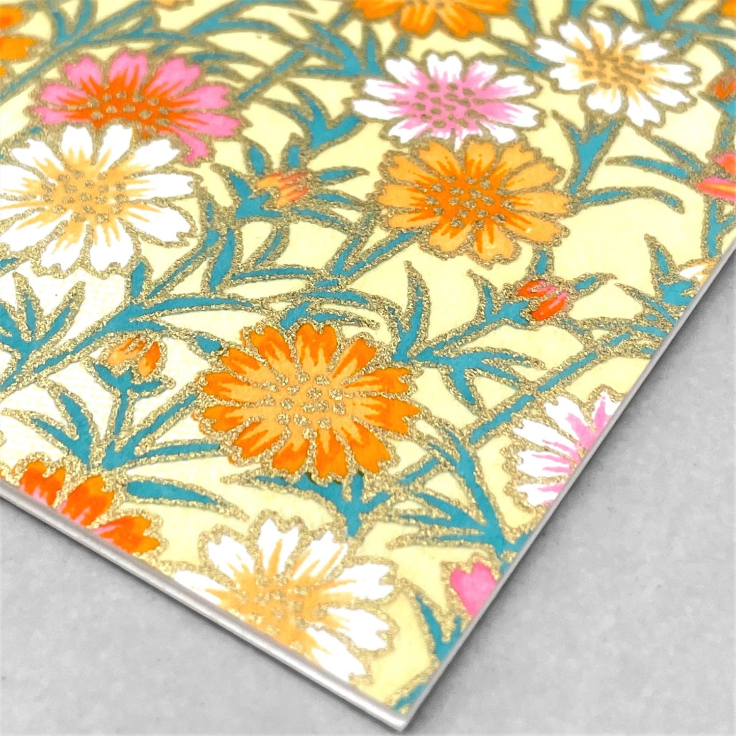 japanese silk-screen printed greetings card with repeat daisy pattern in yellow, pink and orange by Esmie