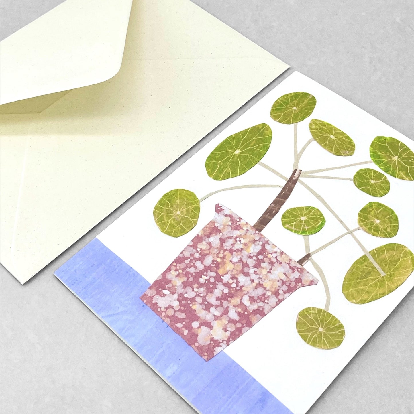 greetings card with pink plant pot and a chinese money plant by Hadley Paper goods