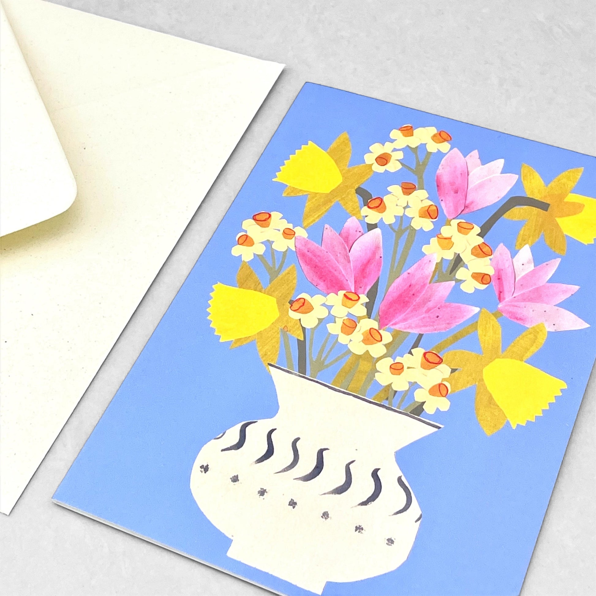 greetings card showing a vase of spring flowers with a blue backdrop by Hadley Paper Goods