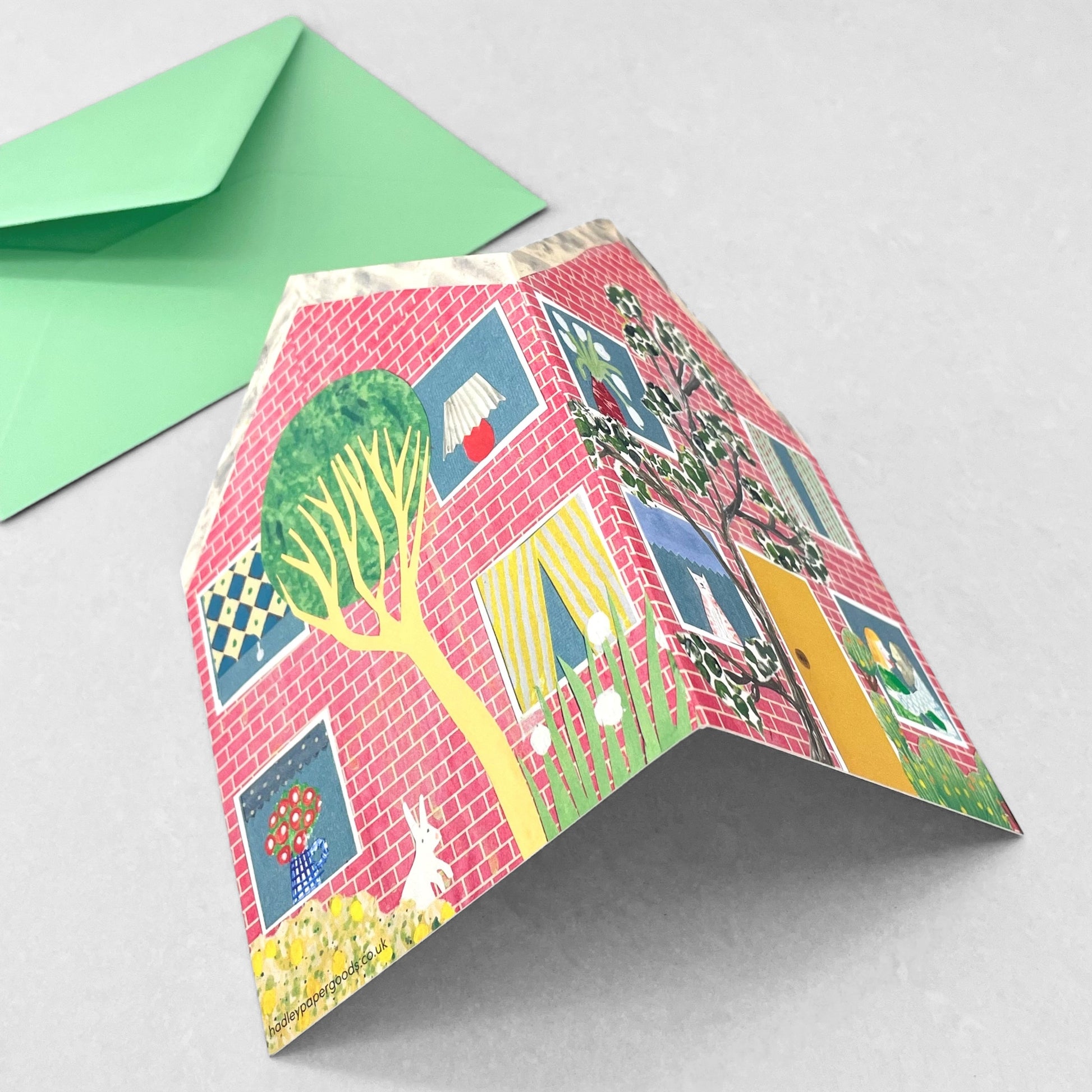 shaped greetings card of a house with four windows and a yellow door by Hadley Paper Goods