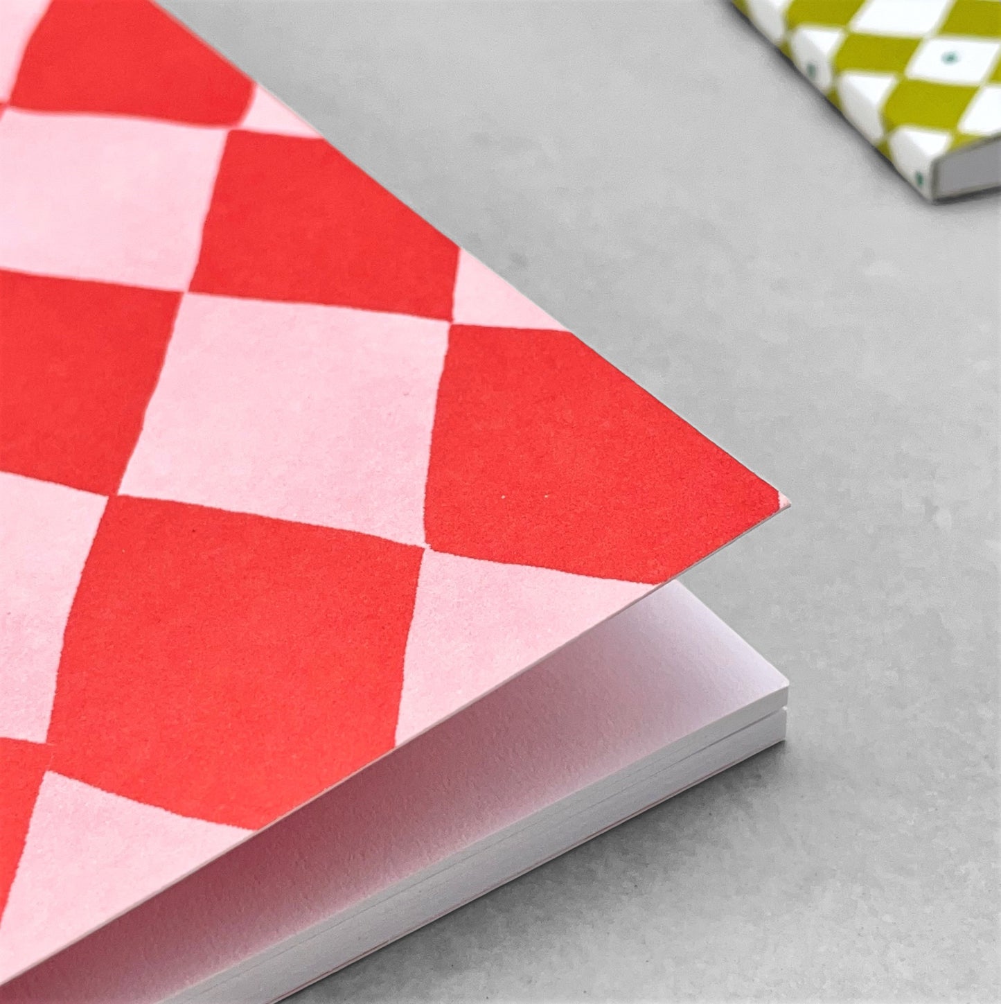 A5 notebook with diamond pattern in red and pink by Heather Evelyn