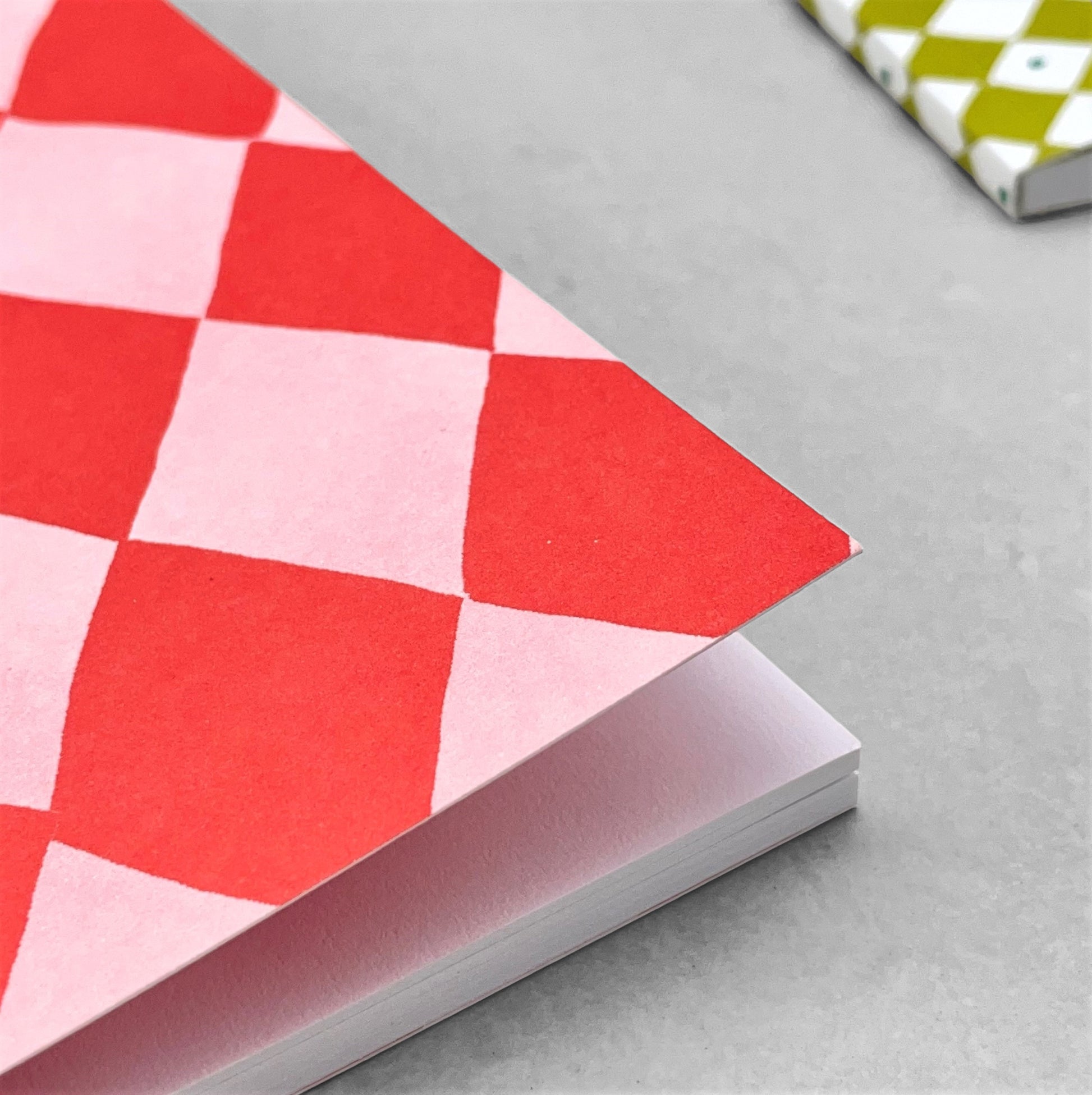 A5 notebook with diamond pattern in red and pink by Heather Evelyn