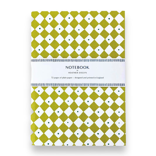 A5 notebook with a diagonal chequered pattern cover in lime green and white. by Heather Evelyn
