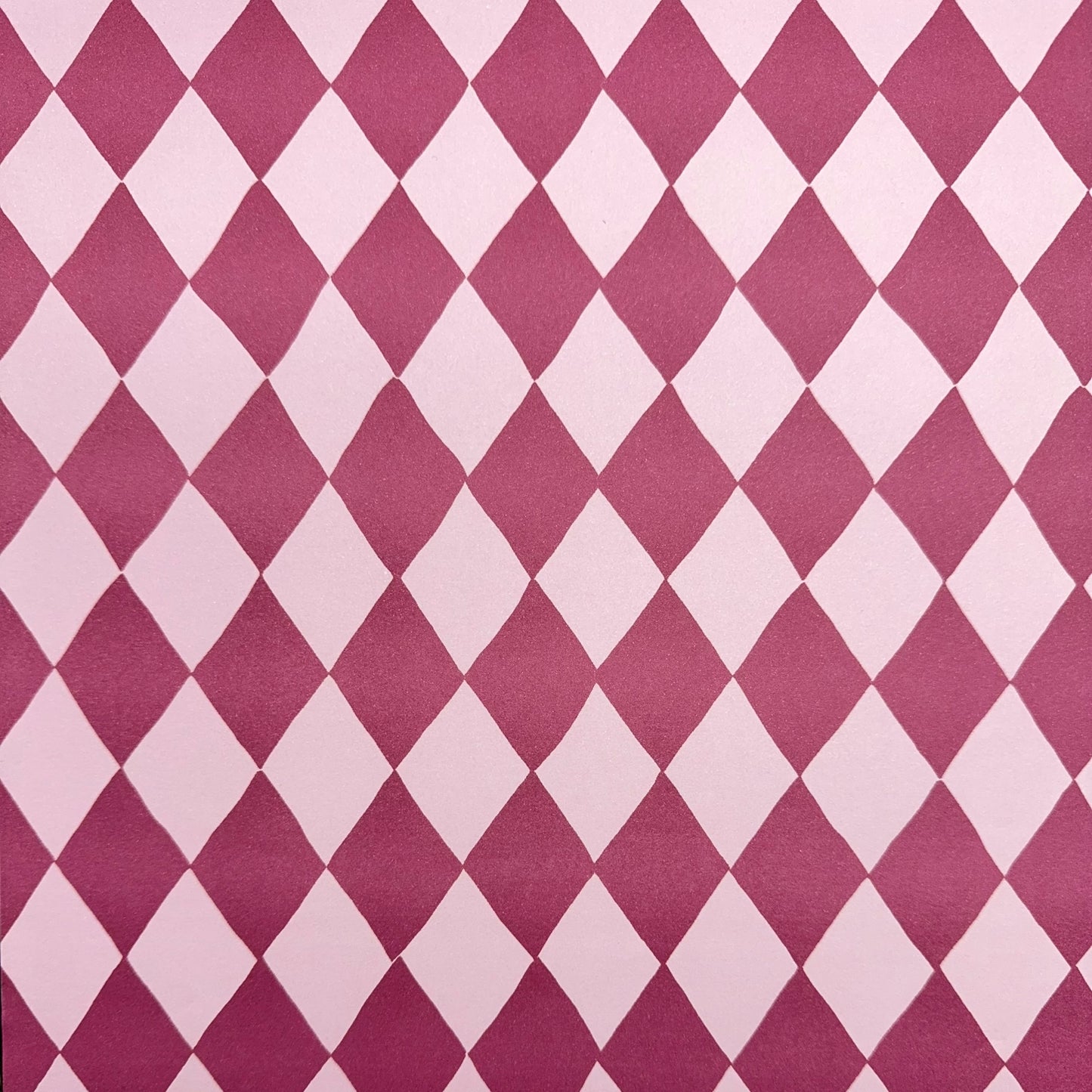 wrapping paper with large diamond design in mauve and pink.