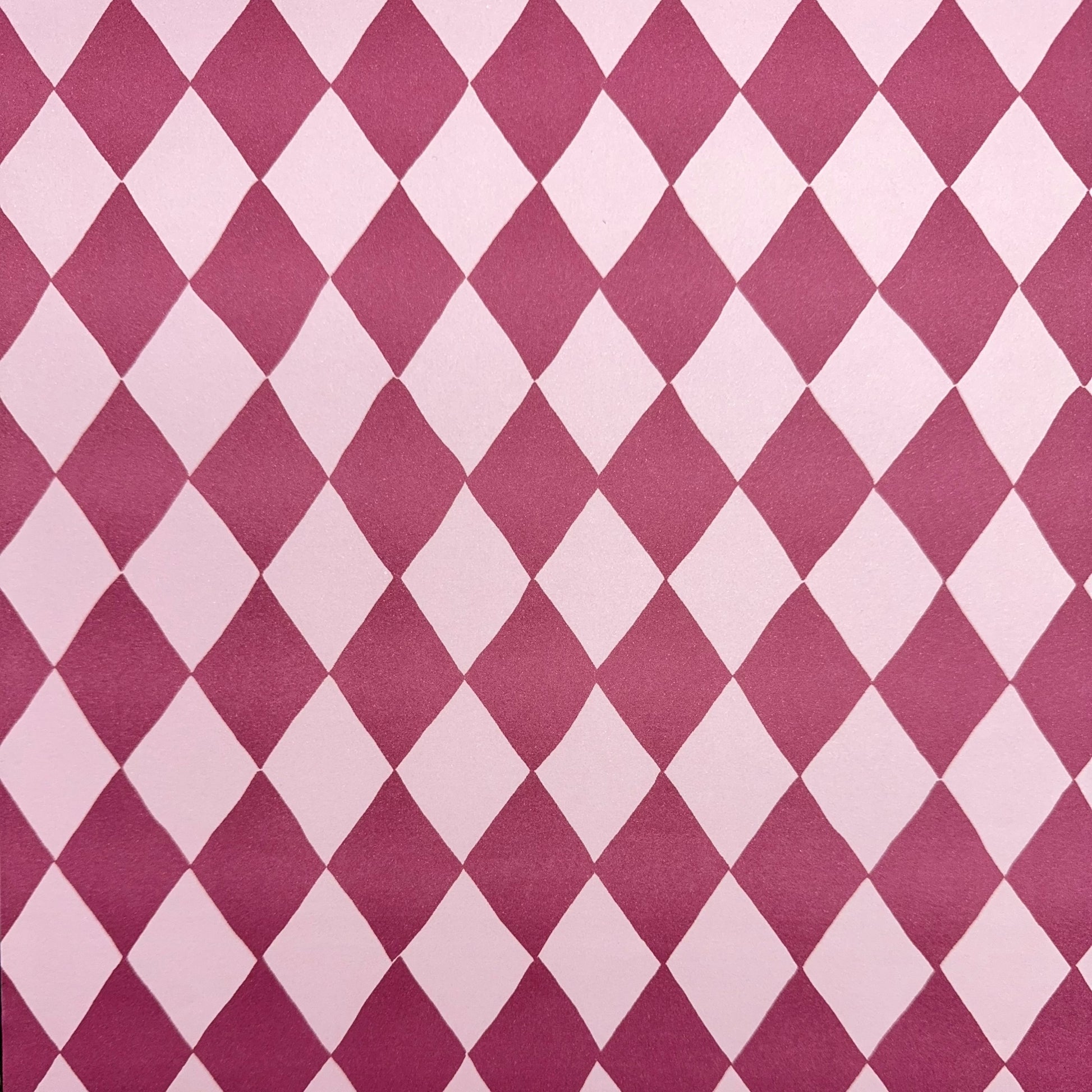 wrapping paper with large diamond design in mauve and pink.