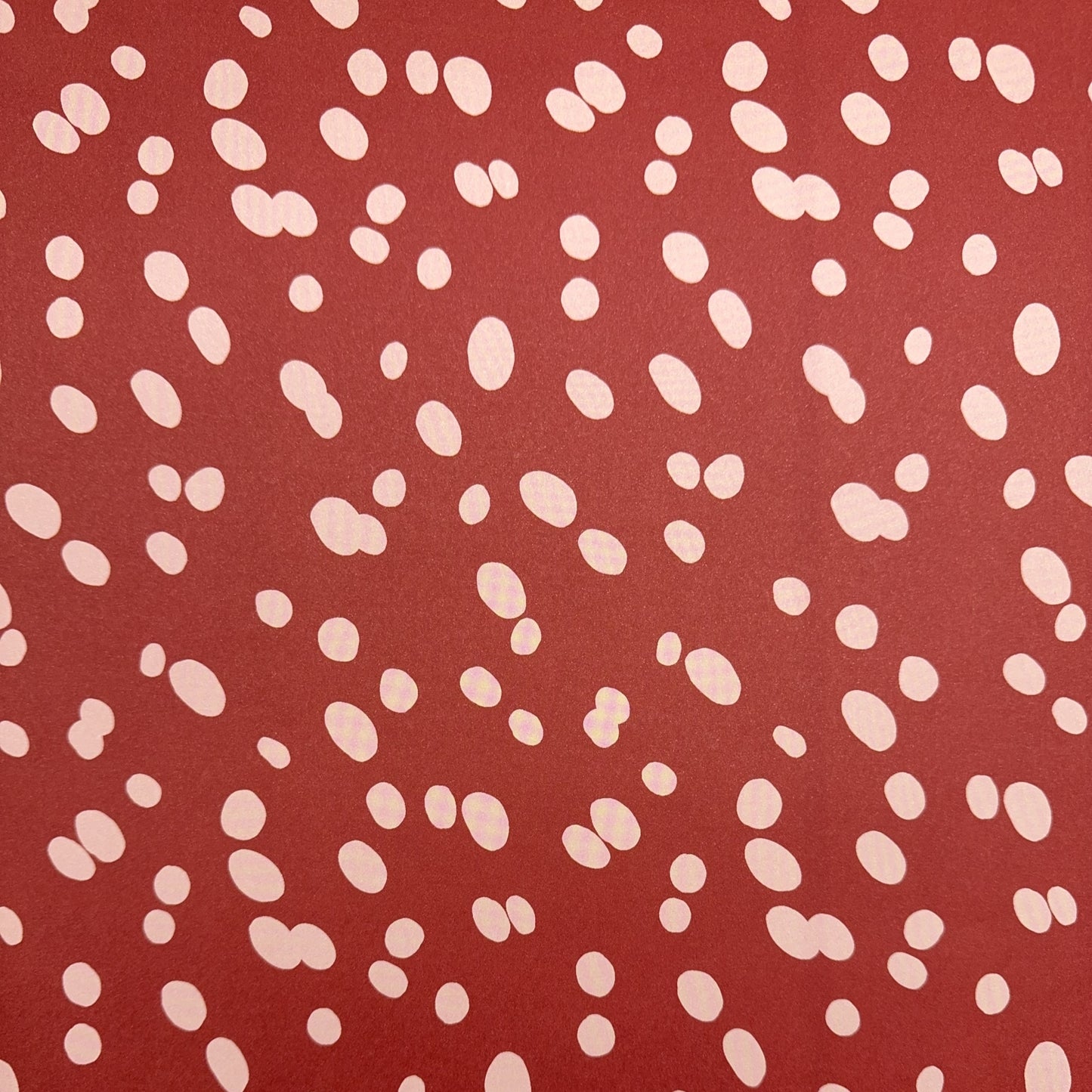 burgundy rouge wrapping paper with random blush pink spots, by Heather Evelyn.