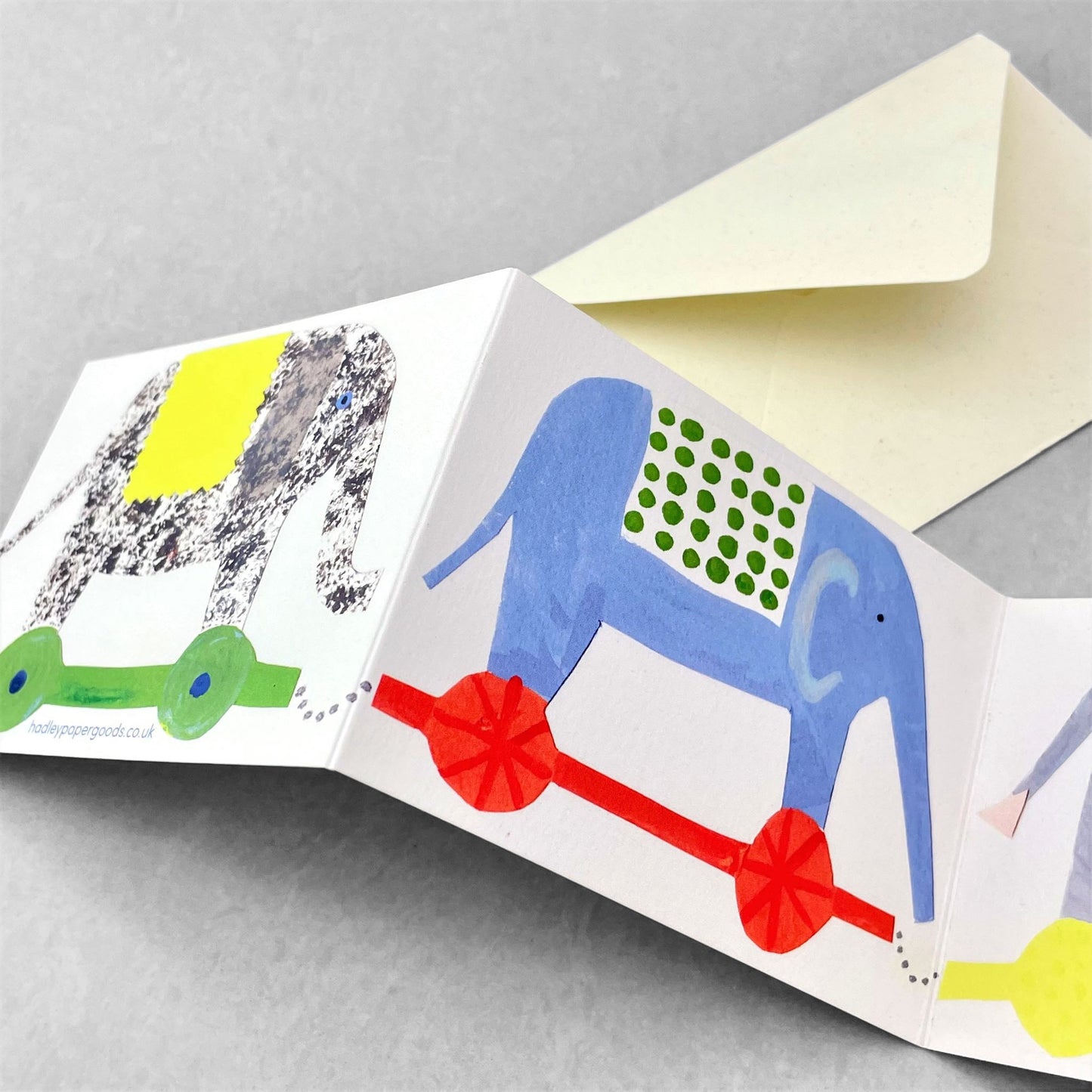 a concertina greetings card of four colourful elephants, by Hadley Paper Goods