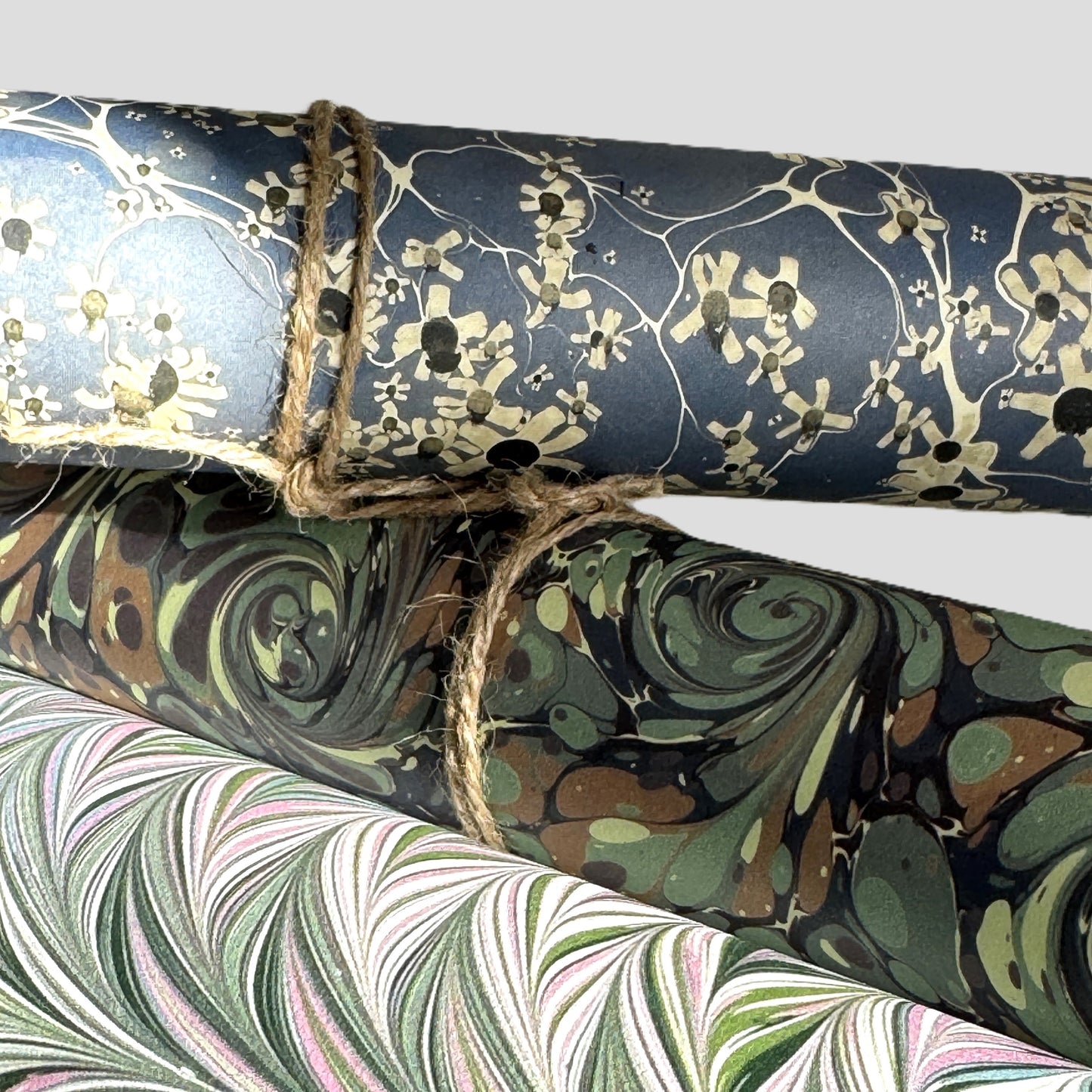 printed marble design wrapping paper by Jemma Lewis.  Daisy flower design in white and black on blue backdrop