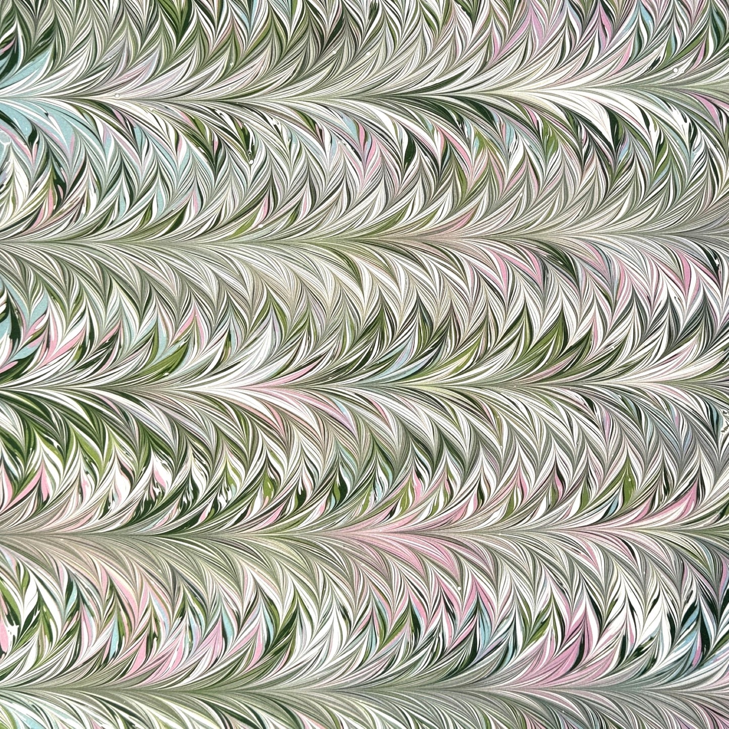 printed marbled design wrapping paper by Jemma Lewis, a feathered marble in green and lilac
