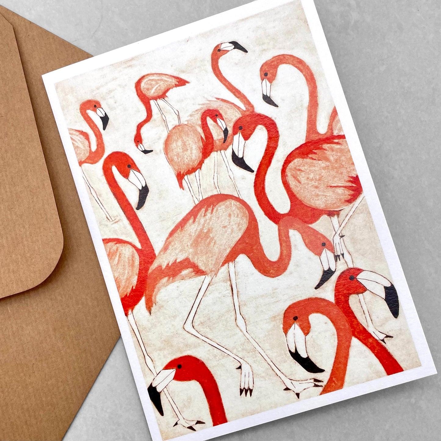 greetings card showing a group of pink flamingos by John Austin Publishing