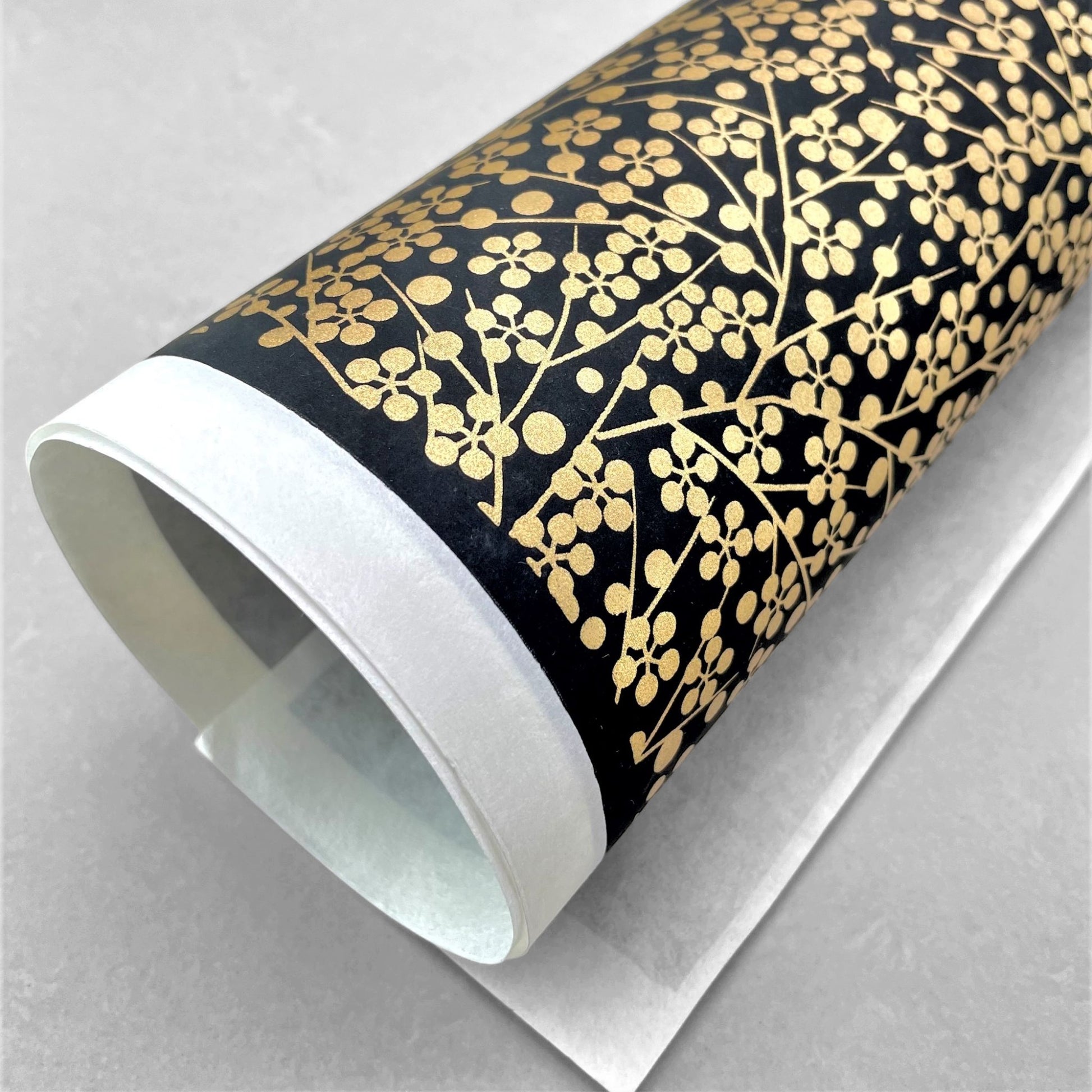 japanese silk-screen handmade paper, chiyogami, with gold abstract pattern on black