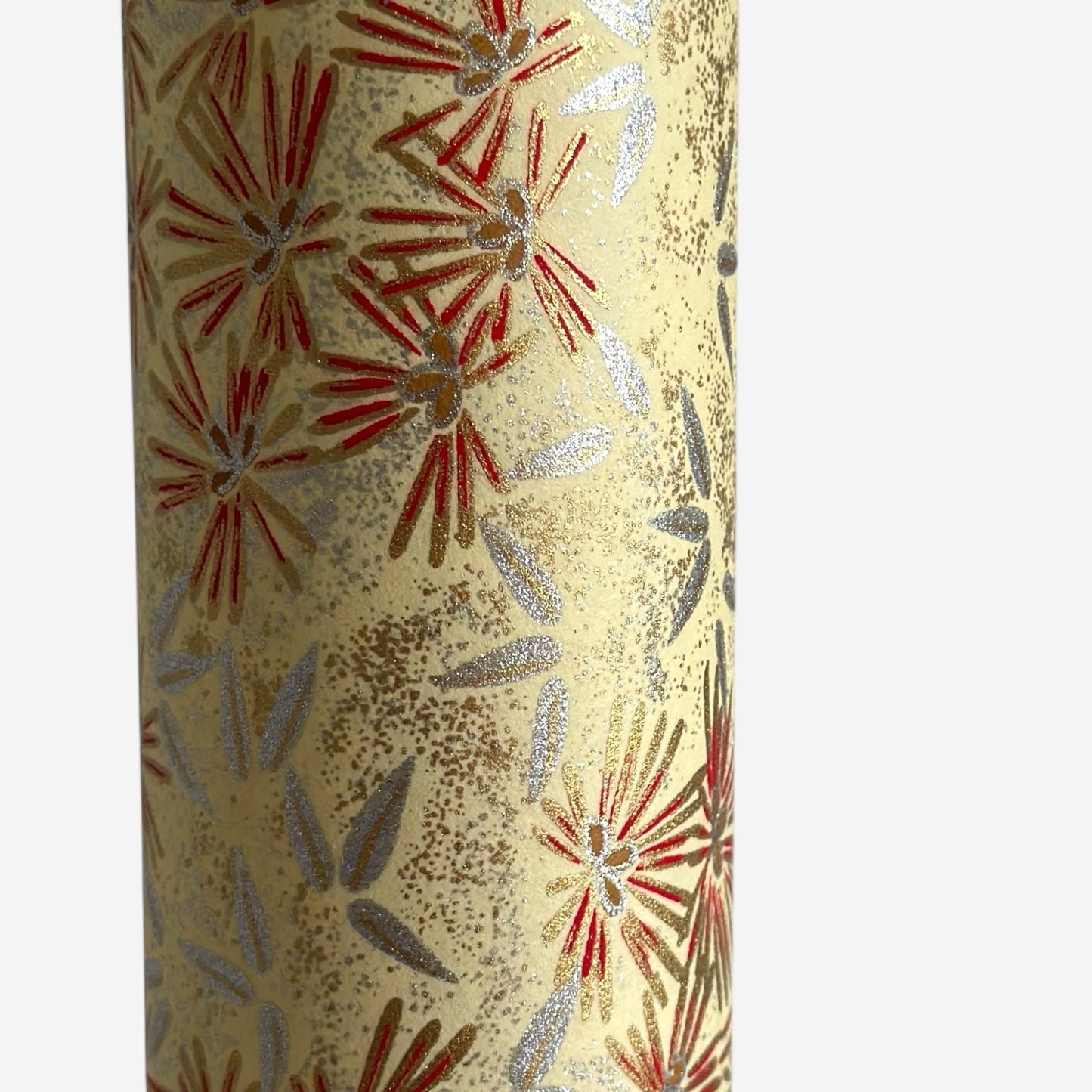 Pattern of scattered pine needles (matsuba) in gold and silver on a cream backdrop. Japanese chiyogami paper.