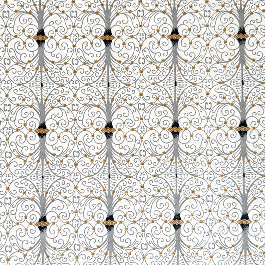 Japanese silkscreen chiyogami paper with a intricate filigree trellis design in grey with gold accent