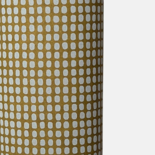 a sheet of Japanese chiyogami paper in olive green with a repeat pattern of light grey rounded rectangles