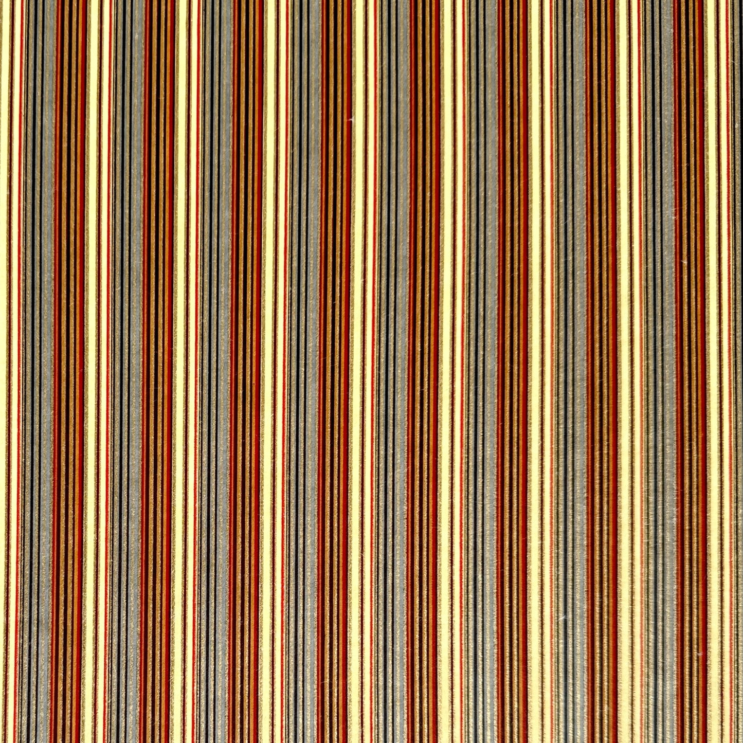 Japanese silkscreen chiyogami paper with a classic narrow stripe pattern in earthy tones of brown, grey, cream, black and gold.