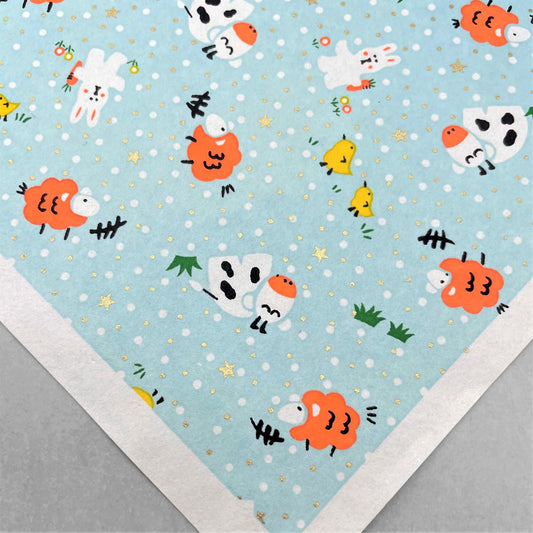 japanese silk-screen handmade paper showing spring animals motifs on a light blue backdrop