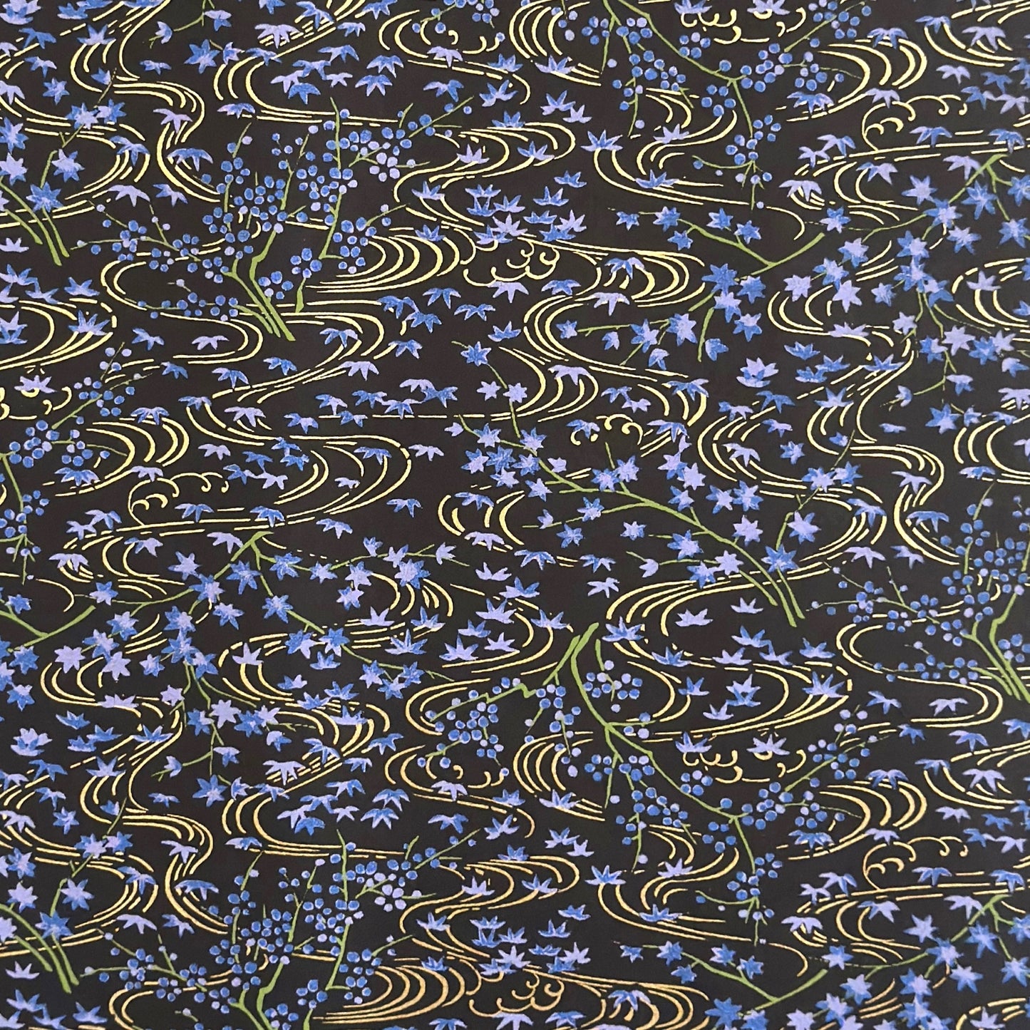 Gold rivers (kawa) with purple falling leaves (fukiyose) and foliage on a black backdrop. Japanese chiyogami paper