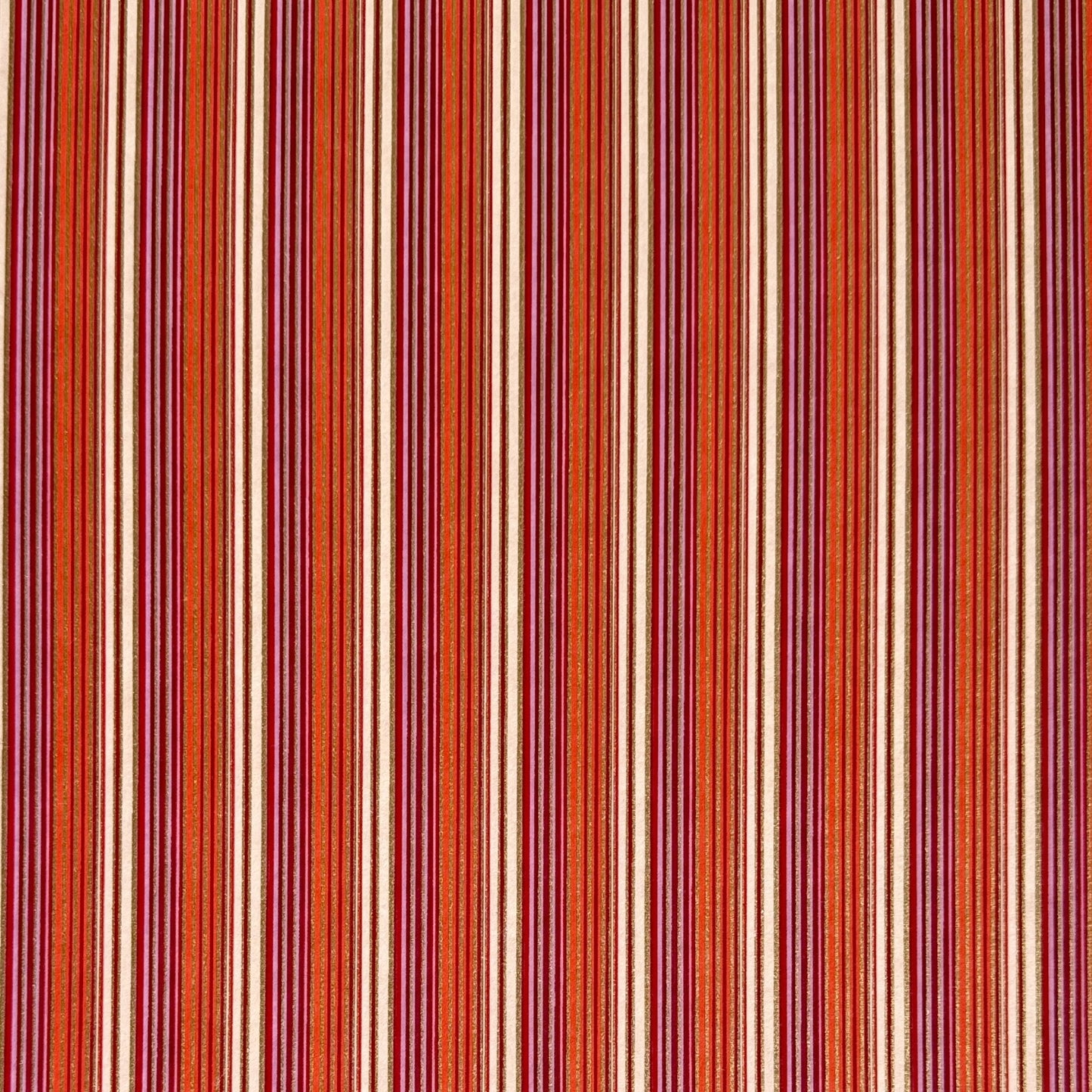 Japanese silkscreen chiyogami paper with a classic narrow stripe pattern in berry tones of red, pink, purple and gold.