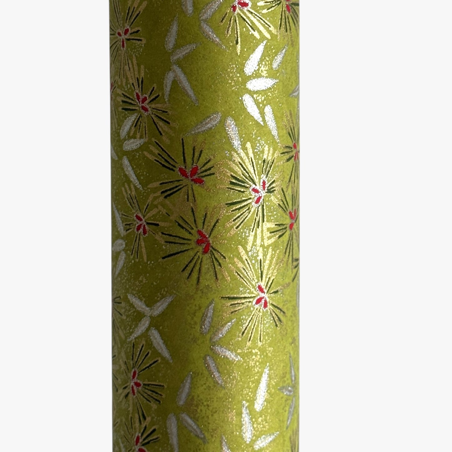 Pattern of scattered pine needles (matsuba) in gold and silver on an olive backdrop. Japanese chiyogami paper. Close up