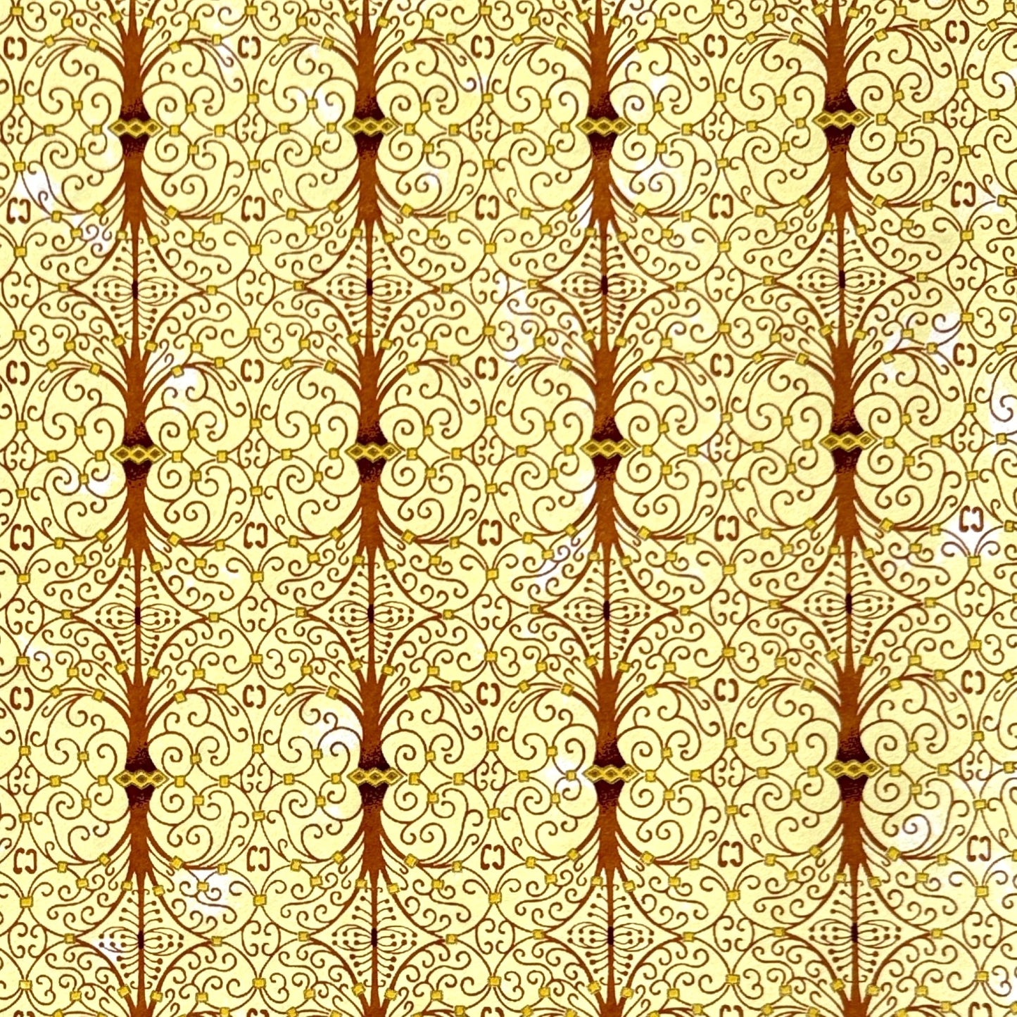 Japanese silkscreen chiyogami paper with a intricate filigree trellis design in brown with gold accent