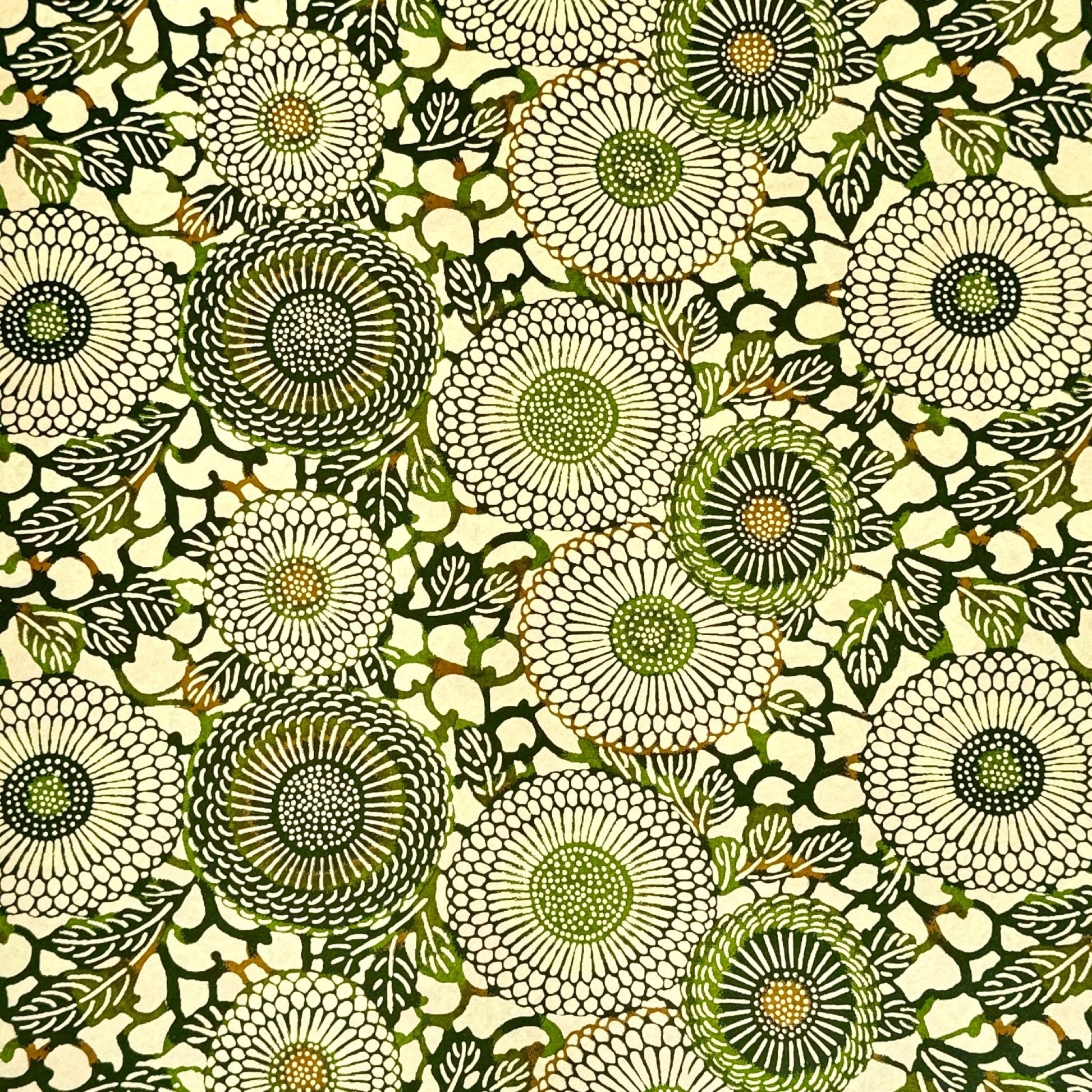 Japanese silkscreen chiyogami paper with a repeat pattern of stylised chrysanthemum flowers in tones of deep green on a buttermilk cream backdrop.
