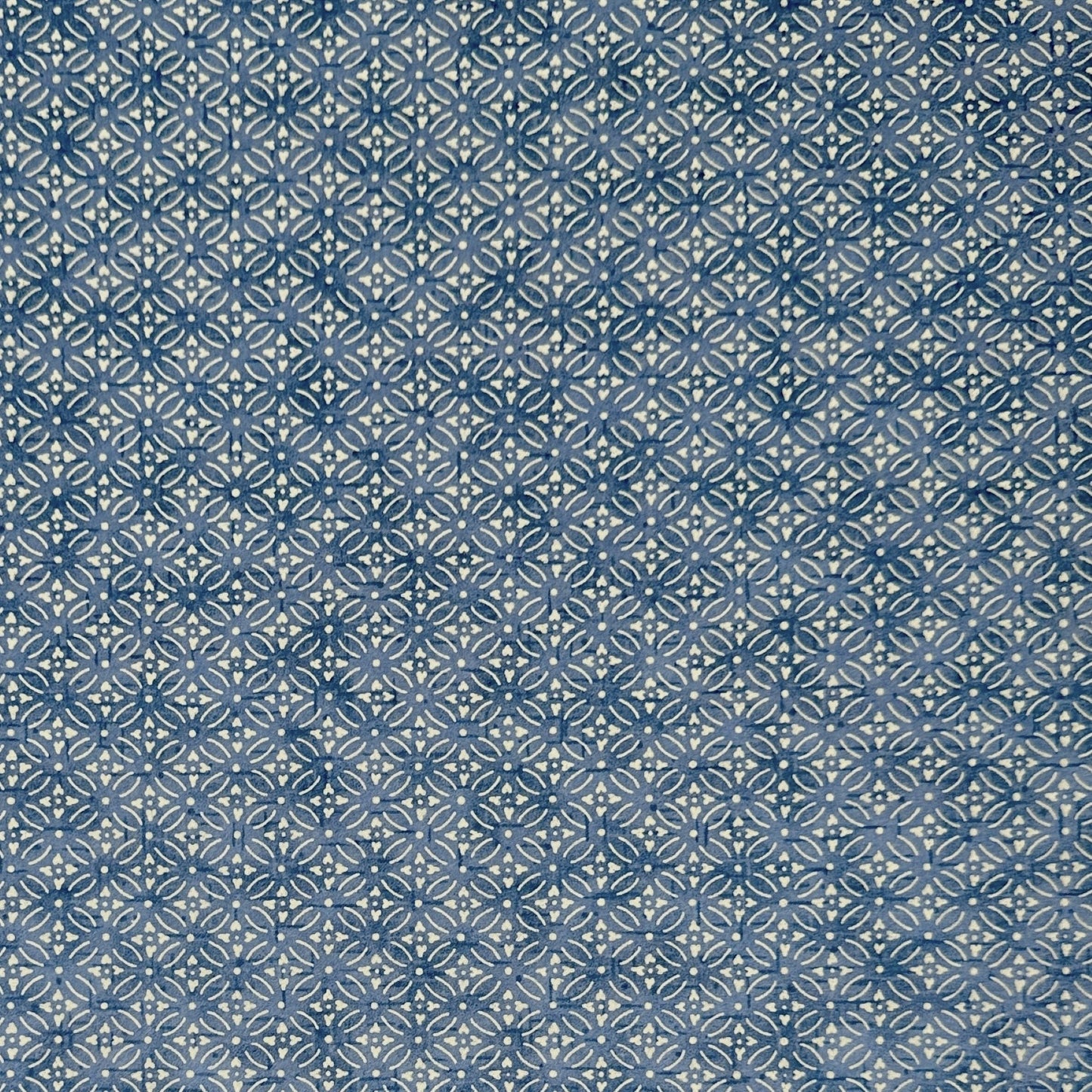 Japanese silkscreen chiyogami paper with a two-tone sky blue geometric pattern on creamy white