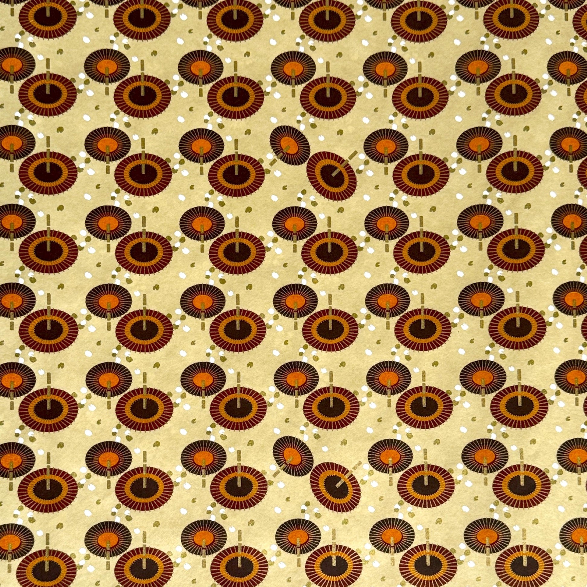 Japanese silkscreen chiyogami paper with a brown and orange umbrella pattern on a buttermilk backdrop