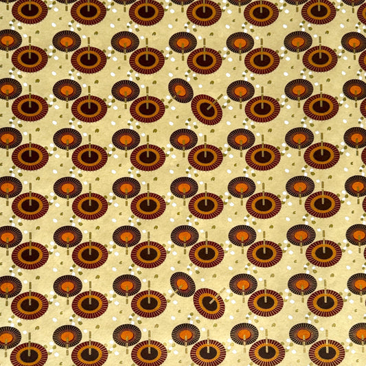 Japanese silkscreen chiyogami paper with a brown and orange umbrella pattern on a buttermilk backdrop