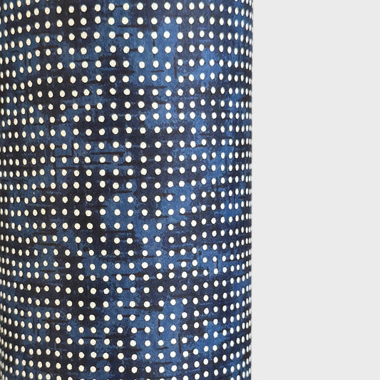 a sheet of indigo Japanese chiyogami paper with tiny white polka dots