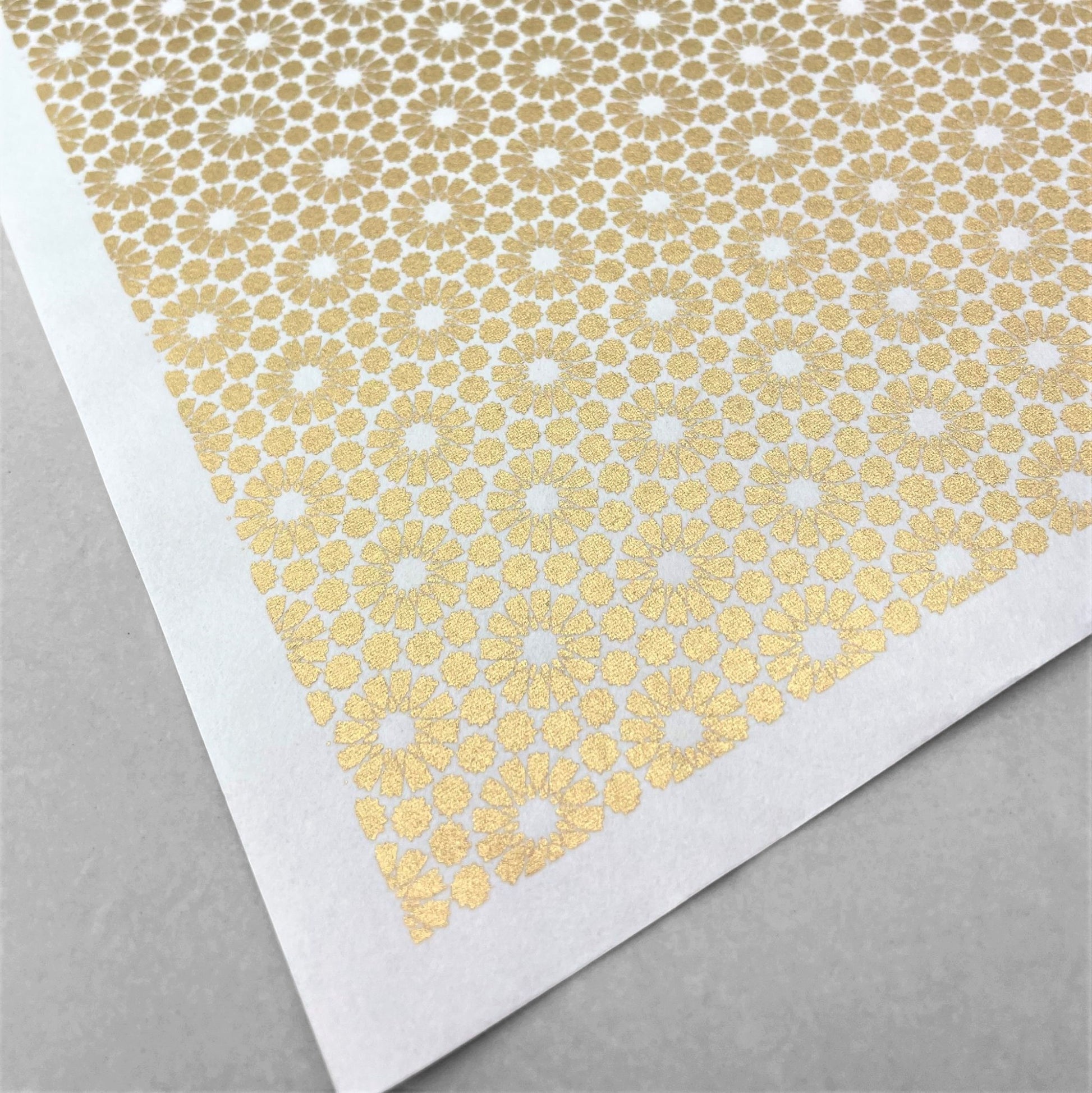 japanese silk-screen handmade paper showing gold repeat chrysanthemum flower motif repeat