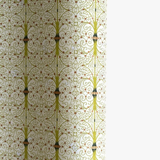 japanese silk-screen handmade paper showing green filigree pattern with gold accents