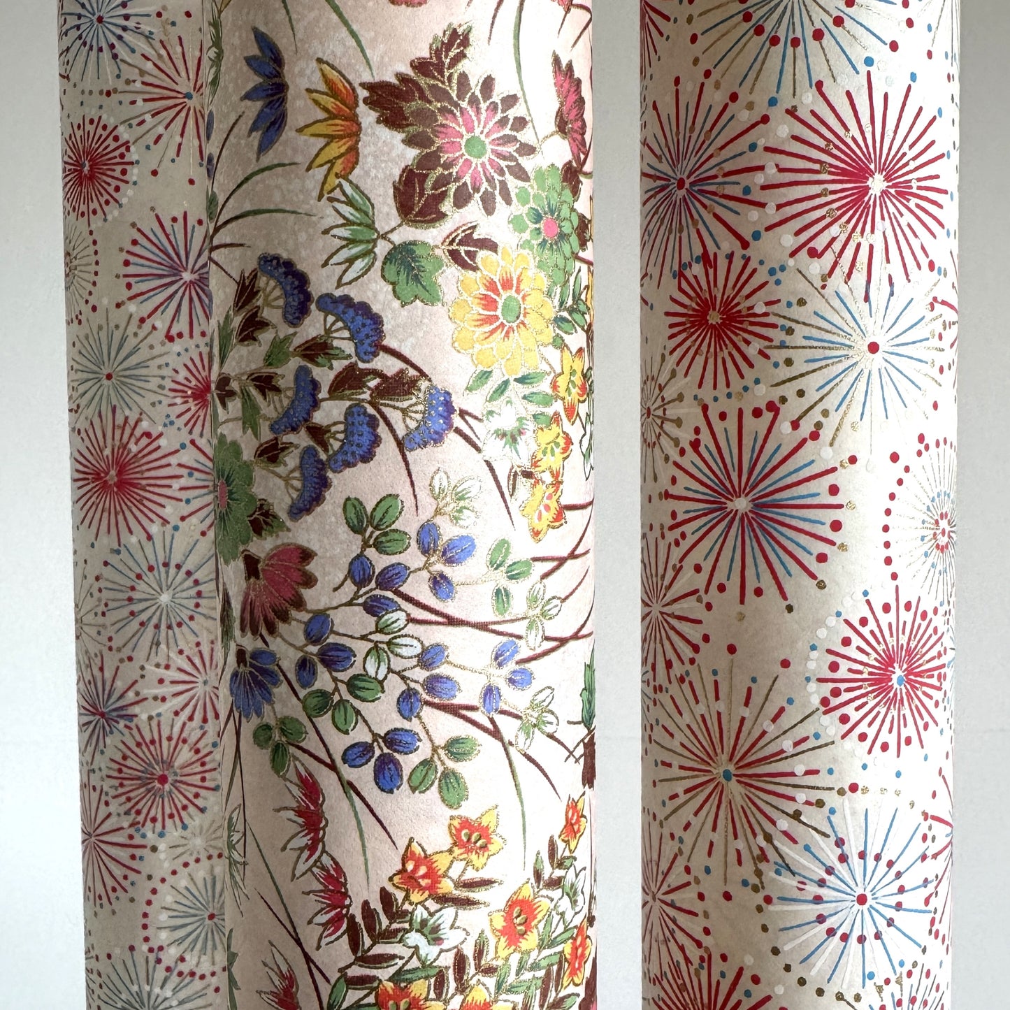 japanese silkscreen printed paper with a delicate floral bouquet design on blush pink background. Close up