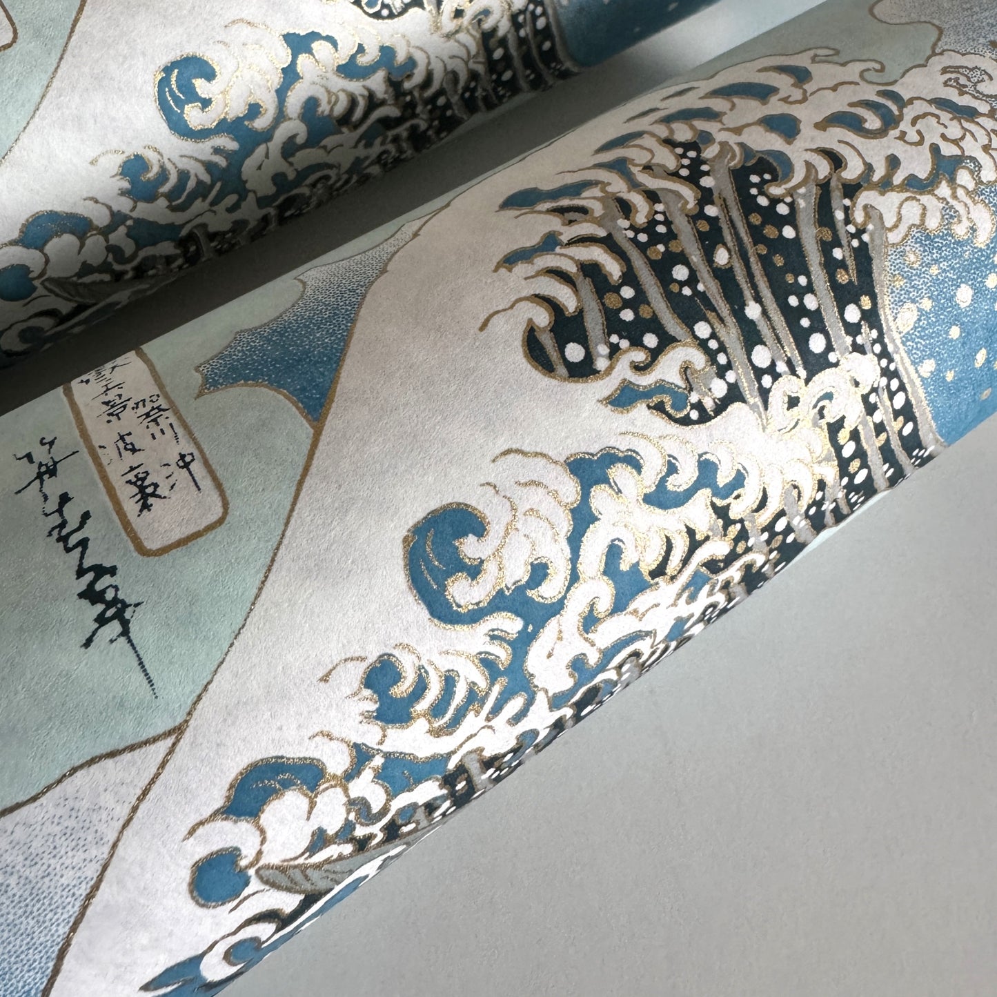 Japanese chiyogami paper with a depiction of the famous Great Wave off Kanagawa. Rolled