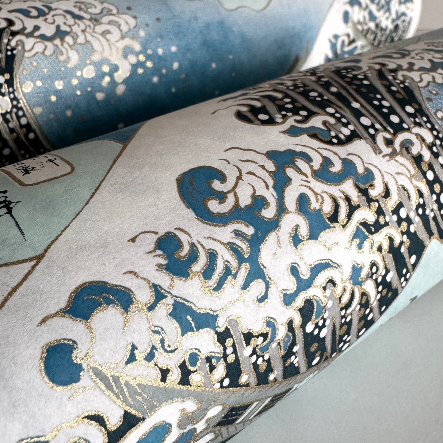 Japanese chiyogami paper with a depiction of the famous Great Wave off Kanagawa. Close up