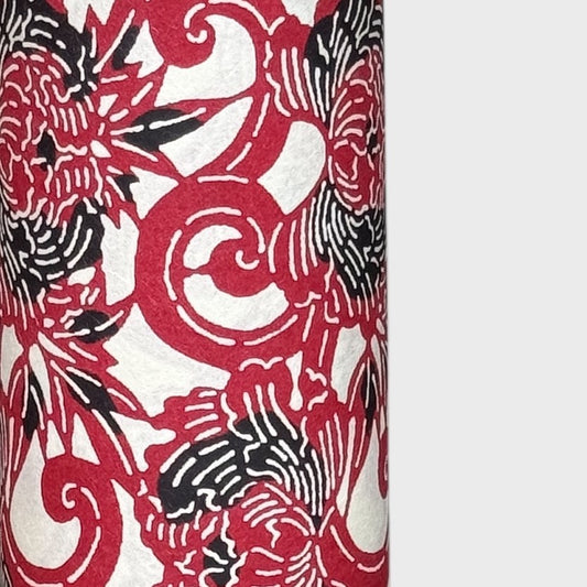 Pattern of berry red peonies (botan) on a sheet of Japanese katazome paper. Close up