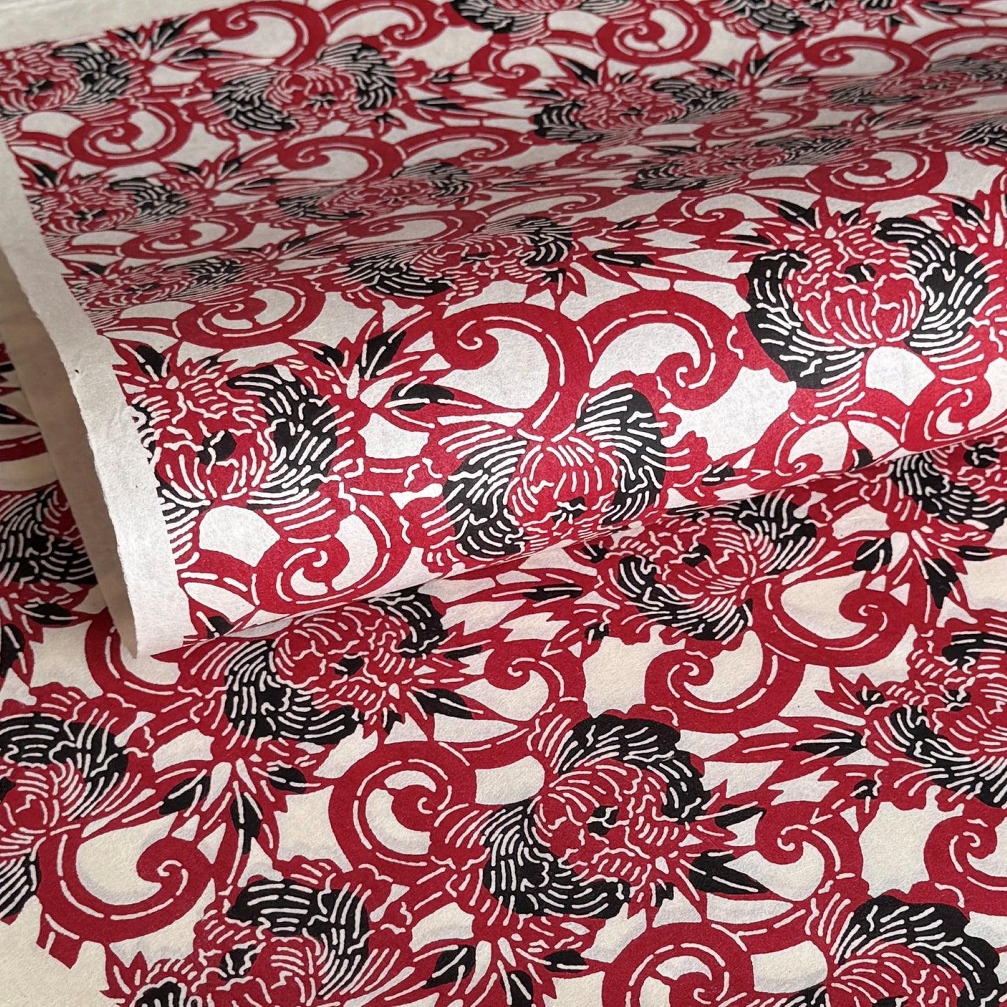 Pattern of berry red peonies (botan) on a sheet of Japanese katazome paper