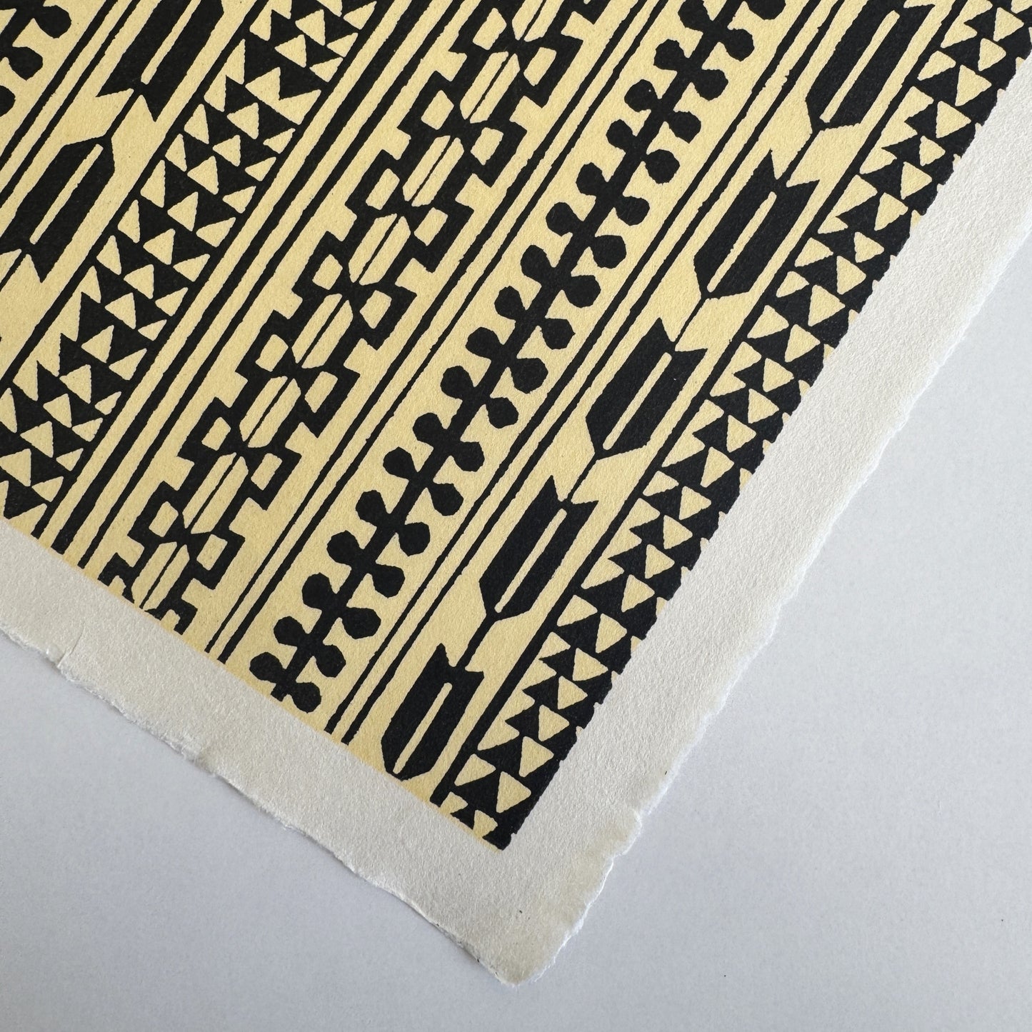 Japanese katazome-shi stencil-dyed paper with striped motifs in black on yellow paper/ Close-up